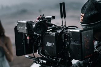 A professional cinema camera filming on a production set
