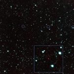 dark rocky asteroid floating against a background of stars