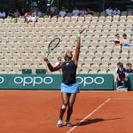 Women's tennis player in action on court