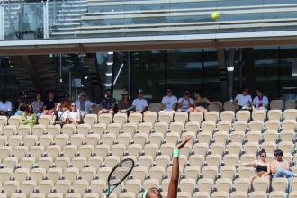 Women's tennis player in action on court