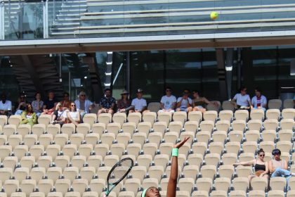 Women's tennis player in action on court