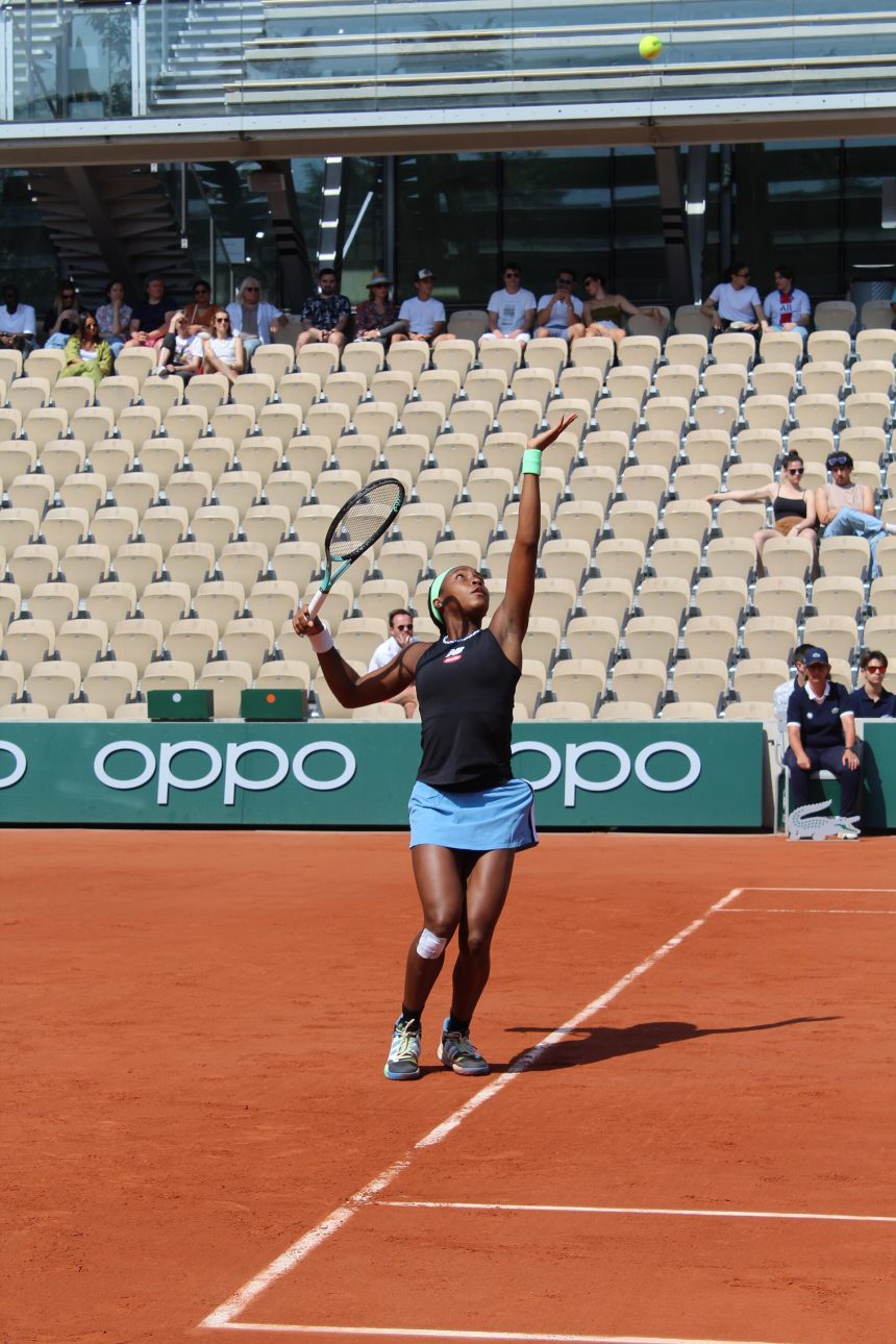 Women's tennis player in action on court