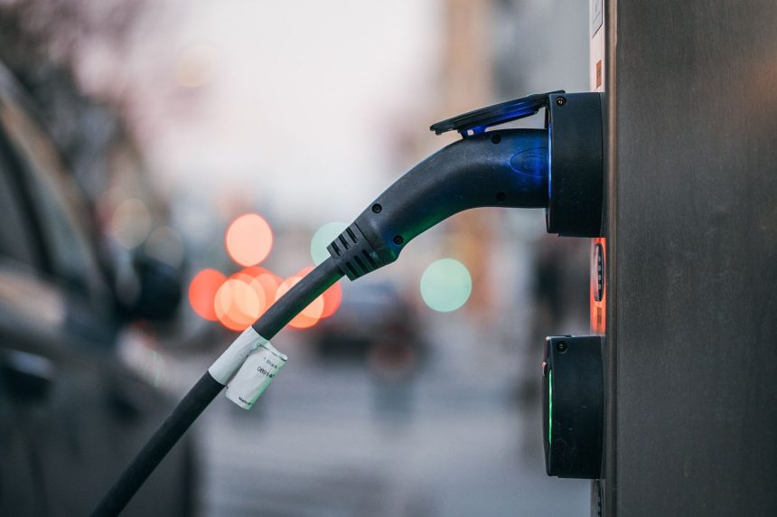 An electric car plugged into a public charging station